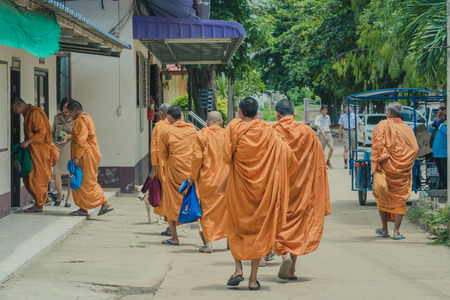 KANCHANABURI THAILAND - JUNE 14 : Unidentified teachers and students make merit to the monks on the Teacher Day on June 14,2018 at Watkrangthongratburana school in Kanchanaburi, Thailandのeditorial素材