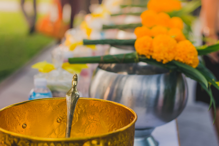 To make merit by offering food to monk ceremony in Thai wedding tradition. Selective focus on rice ladle.の写真素材