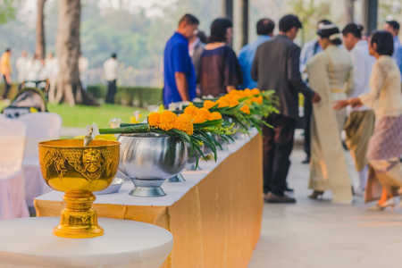 To make merit by offering food to monk ceremony in Thai wedding tradition. Selective focus on rice ladle.の写真素材