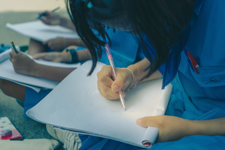 Students try to drawing Thai motifs from Thai architecture in the temple.の写真素材