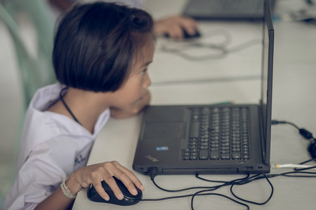 KANCHANABURI THAILAND - JULY 11 : Unidentified Student study by computer in classroom on July 11,2018 at Watkrangthongratburana school in Kanchanaburi, Thailandのeditorial素材