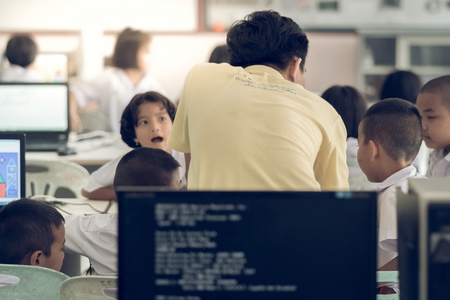 KANCHANABURI THAILAND - JULY 11 : Unidentified Student study by computer in classroom on July...