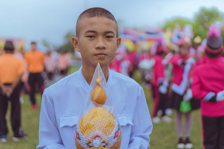 KANCHANABURI THAILAND - JULY 18 :  Parade on street, in athletic game opening day of primary student in the rain on July 18,2018 at Nongthabong School in Kanchanaburi, Thailandのeditorial素材