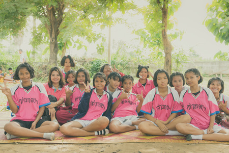 KANCHANABURI THAILAND - JULY 18 :   Unidentified female students play volleyball at the public park on July 18,2018  in Kanchanaburi, Thailandのeditorial素材