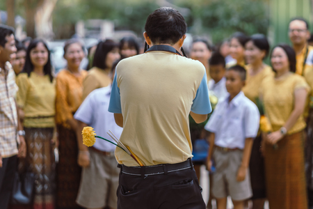 KANCHANABURI THAILAND - JULY 26 : Unidentified teacher and students waited for time to go to temple in traditional lent candle festival for Buddhist Lent Day on July 26,2018 at Watkrangthongratburana school in Kanchanaburi, Thailandのeditorial素材