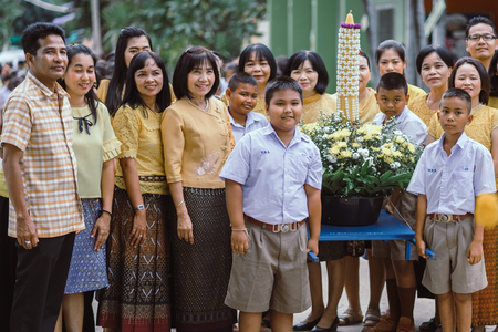 KANCHANABURI THAILAND - JULY 26 : Unidentified teacher and students waited for time to go to temple in traditional lent candle festival for Buddhist Lent Day on July 26,2018 at Watkrangthongratburana school in Kanchanaburi, Thailandのeditorial素材