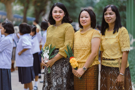KANCHANABURI THAILAND - JULY 26 : Unidentified teacher and students waited for time to go to temple in traditional lent candle festival for Buddhist Lent Day on July 26,2018 at Watkrangthongratburana school in Kanchanaburi, Thailandのeditorial素材