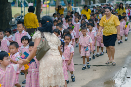KANCHANABURI THAILAND - JULY 26 : Thai students in candle parade, Buddhist lent candle festival on July 26,2018 at Watkrangthongratburana school in Kanchanaburi, Thailandのeditorial素材