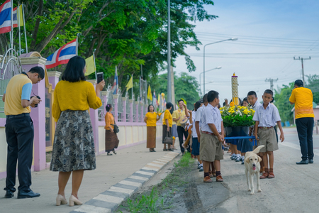 KANCHANABURI THAILAND - JULY 26 : Thai students in candle parade, Buddhist lent candle festival on July 26,2018 at Watkrangthongratburana school in Kanchanaburi, Thailandのeditorial素材