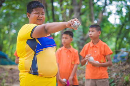 KANCHANABURI THAILAND - JULY 25 :   Unidentified Students and teachers  practice petanque at BanNongthabong school on July 25,2018  in Kanchanaburi, Thailandのeditorial素材