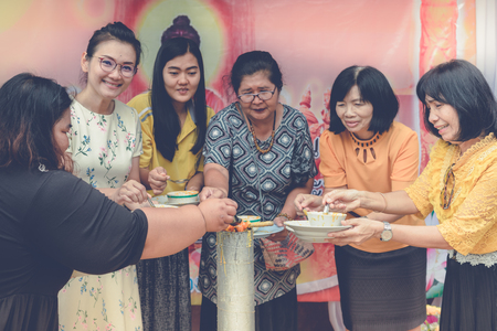 KANCHANABURI THAILAND - JULY 24 :  Unidentified Teacher and students join melting cast candle offer to temple in traditional lent candle festival for Buddhist Lent Day on July 24,2018 at Watkrangthongratburana school in Kanchanaburi, Thailandのeditorial素材