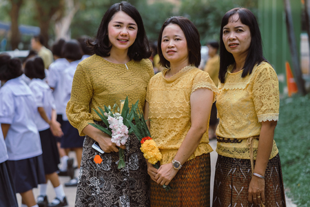 KANCHANABURI THAILAND - JULY 26 : Unidentified teacher and students waited for time to go to temple in traditional lent candle festival for Buddhist Lent Day on July 26,2018 at Watkrangthongratburana school in Kanchanaburi, Thailandのeditorial素材