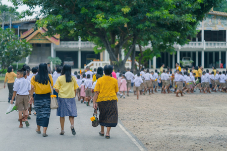 KANCHANABURI THAILAND - JULY 26 : Thai students in candle parade, Buddhist lent candle festival on July 26,2018 at Watkrangthongratburana school in Kanchanaburi, Thailandのeditorial素材