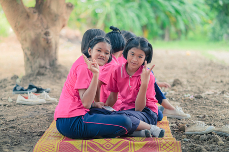 KANCHANABURI THAILAND - JULY 18 :  Unidentified Students relax after lunch on July 18,2018 at Nongthabong School in Kanchanaburi, Thailandのeditorial素材