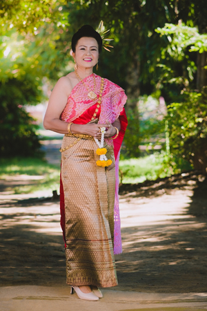 KANCHANABURI THAILAND - SEPTEMBER 28 :   Unidentified female teacher take a photo before Thai dance show on stage on September 28,2018 at Watkrangthongratburana school in Kanchanaburi, Thailandのeditorial素材
