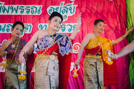 KANCHANABURI THAILAND - SEPTEMBER 28 :   Unidentiffied female teachers perform Thai dance on stage for retirement on September 28,2018 at Watkrangthongratburana school in Kanchanaburi, Thailandのeditorial素材