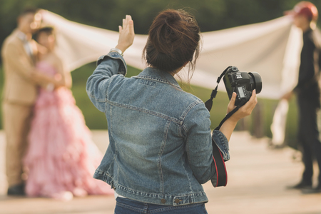 Photographer take pre-wedding photos of the bride and groom in the afternoon.の写真素材