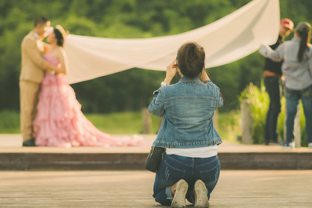 Photographer take pre-wedding photos of the bride and groom in the afternoon.の写真素材