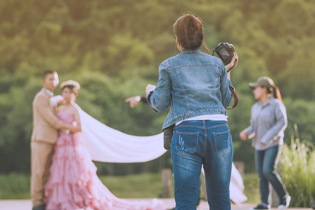 Photographer take pre-wedding photos of the bride and groom in the afternoon.の写真素材