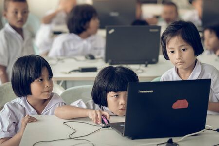 KANCHANABURI THAILAND - JULY 11 : Unidentified Student study by computer in classroom on July 11,2018 at Watkrangthongratburana school in Kanchanaburi, Thailandのeditorial素材