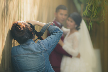 Photographer take pre-wedding photos of the bride and groom in the afternoon.の写真素材