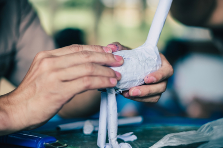 Students learn to make paper mache art as a giraffe in school.の写真素材