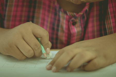 Students try to drawing a basic pattern Thailand with a pencil in classroom