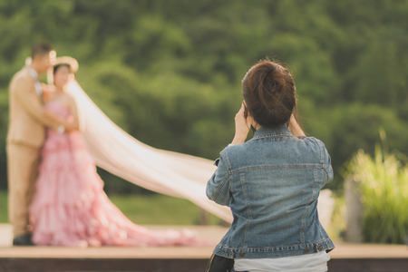 Photographer take pre-wedding photos of the bride and groom in the afternoon.の写真素材