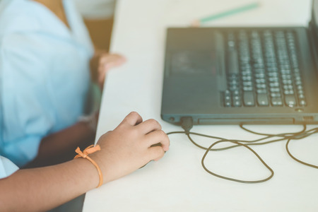 Close up to Student hands practice drawing art by computer in classroom.の写真素材