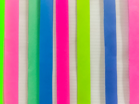 Colored paper strips decorate on boardの写真素材