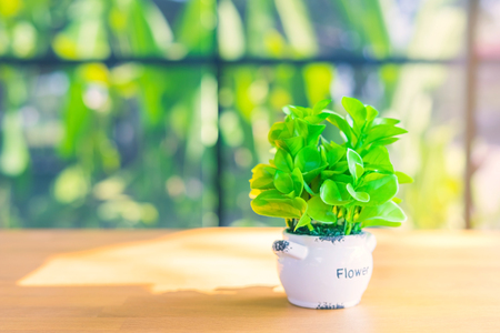 Artificial plants or plastic tree on table for decoration and welcome for customers in  cafeの写真素材
