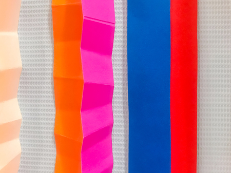 Colored paper strips decorate on boardの写真素材