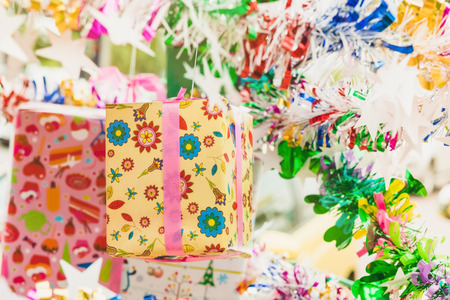 Colorful tinsel and gift decoration for a  Christmas tree and a happy new yearの写真素材