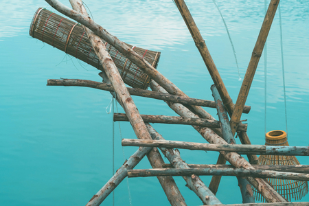 Ancient bamboo fish trap equipment of countryside, Thailandの写真素材