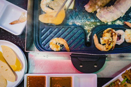 Happiness Enjoy eating Korean BBQ traditional famous food with family in a Korean restaurant
