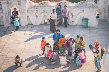MINGUN-Myanmar, January 20, 2019 : Unidentified tourists make merit, pay homage to blessings at Mya Thein Tan Pagoda on january 20,2019 in Mingun, Myanmar.のeditorial素材