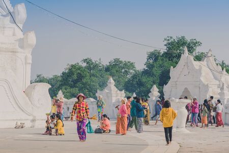 MINGUN-Myanmar, January 20, 2019 : Unidentified tourists make merit, pay homage to blessings at Mya...