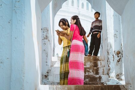 MINGUN-Myanmar, January 20, 2019 : Unidentified tourists walking and photographing at Mya Thein Tan Pagoda on january 20,2019 in Mingun, Myanmar.のeditorial素材