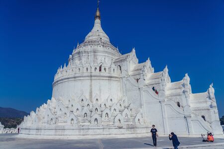 MINGUN-Myanmar, January 20, 2019 : Unidentified tourists walking and photographing at Mya Thein Tan Pagoda on january 20,2019 in Mingun, Myanmar.のeditorial素材