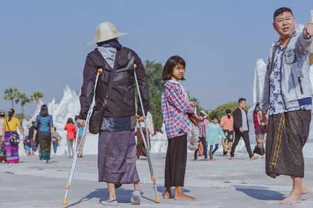 MINGUN-Myanmar, January 20, 2019 : Unidentified tourists walking and photographing at Mya Thein Tan Pagoda on january 20,2019 in Mingun, Myanmar.のeditorial素材