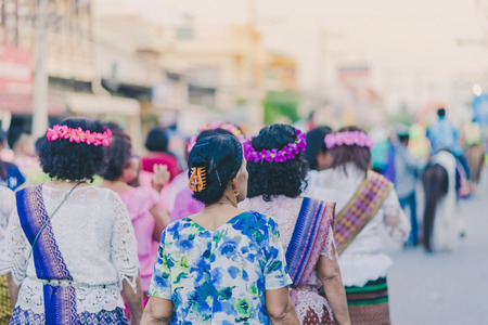 Happiness  villagers dressed in beautiful local costumes join the parade to celebrate Songkran Festival at Ban Nong Khao in Kanchanaburi, Thailand.のeditorial素材