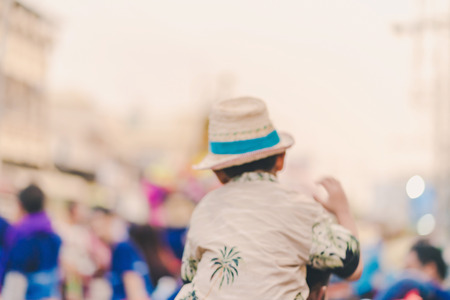 Blur of Happiness  villagers dressed in beautiful local costumes join the parade to celebrate Songkran Festival at Ban Nong Khao in Kanchanaburi, Thailand.の写真素材