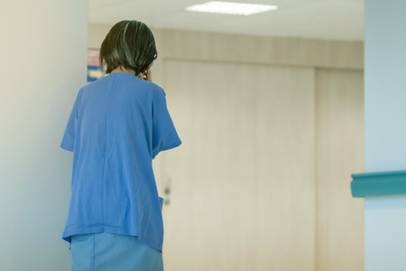 Female urinary tract patients walking for exercise and rest alone in the hospitalの写真素材