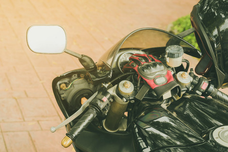 A sporty motorcycle parked in front of a coffee shopの写真素材