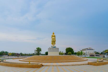 KANCHANABURI THAILAND - APRIL 5 : A Golden Buddha statues located on Mae Klong dam on April 5,2019 in Kanchanaburi, Thailandのeditorial素材
