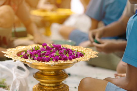 Students help each other to create a flowers tray with pedestal  for The Teachersâ€™ Day