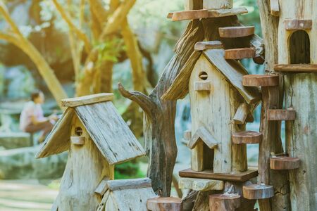Hand made wooden bird house nest  in public Park , hand wood shelter for birdsの写真素材