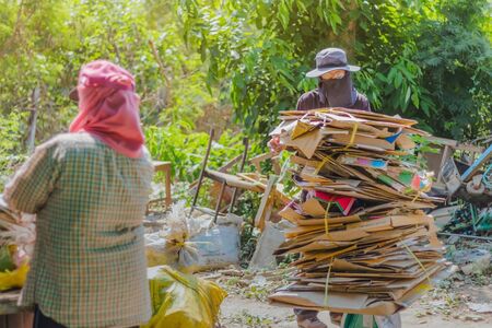 KANCHANABURI, THAILAND - FEBRUARY 13 2018: Unidentified Junk buyers are sorting waste that is not used for proper recycling at school on february 13, 2018 in Kanchanaburi, Thailandのeditorial素材