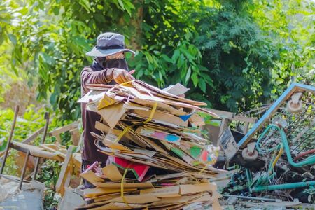 KANCHANABURI, THAILAND - FEBRUARY 13 2018: Unidentified Junk buyers are sorting waste that is not used for proper recycling at school on february 13.2018 in Kanchanaburi,Thailandのeditorial素材