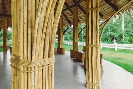 Many bamboo bindings are tied together with hemp ropes to be used as pole for resting cottage. Selective focus on hemp ropes.の写真素材